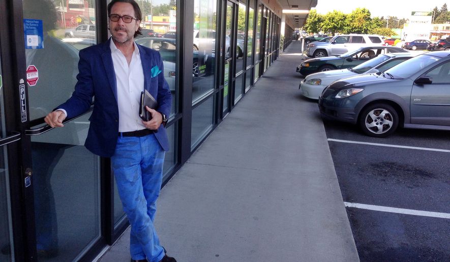 In this photo taken Tuesday, Aug. 26, 2014 Edward “Tedd” Wetherbee stands in front of a storefront in Fife,Wash. Dozens of cities in the state have banned pot farms and stores. One of those cities, the tiny Tacoma suburb of Fife, is defending its right to remain pot-shop-free in court. Fife has invoked something of a nuclear option: the argument that federal law prohibits the state from regulating marijuana. (AP Photo/Gene Johnson)