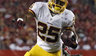 Washington Redskins running back Chris Thompson (25) is tripped by Tampa Bay Buccaneers defensive end Ronald Talley during the second quarter of an NFL preseason football game Thursday, Aug. 28, 2014, in Tampa, Fla. (AP Photo/Brian Blanco)