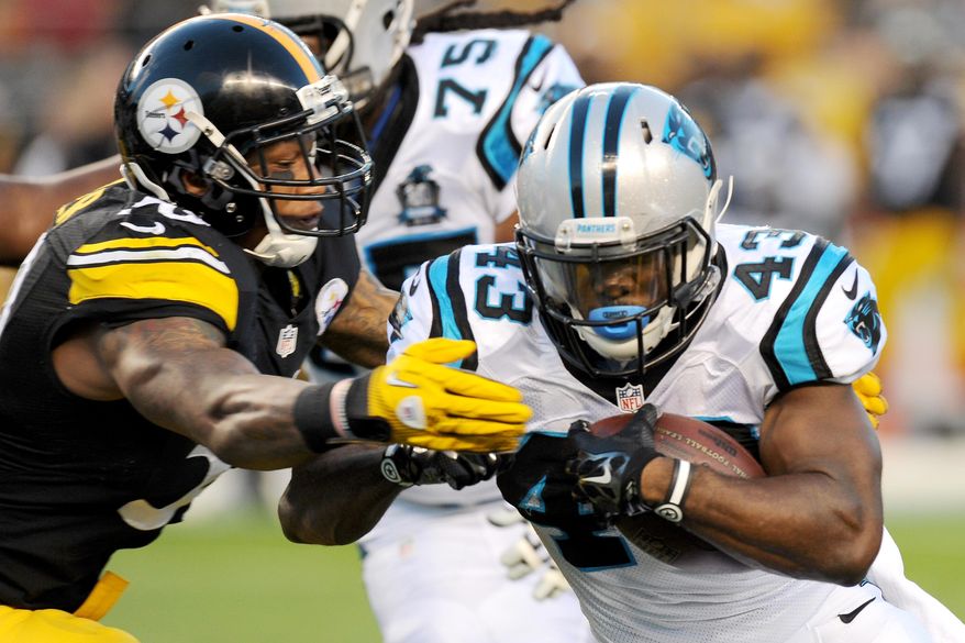 Carolina Panthers running back Fozzy Whittaker (43) is hit by Pittsburgh Steelers outside linebacker Ryan Shazier (50) in the first quarter of the NFL preseason football game on Thursday, Aug. 28, 2014 in Pittsburgh. (AP Photo/Don Wright)