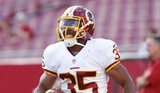 Washington Redskins safety Akeem Davis (35) warms up before the start of a preseason NFL football game against the Tampa Bay Buccaneers Thursday, Aug. 28, 2014, in Tampa, Fla. (AP Photo/Brian Blanco)