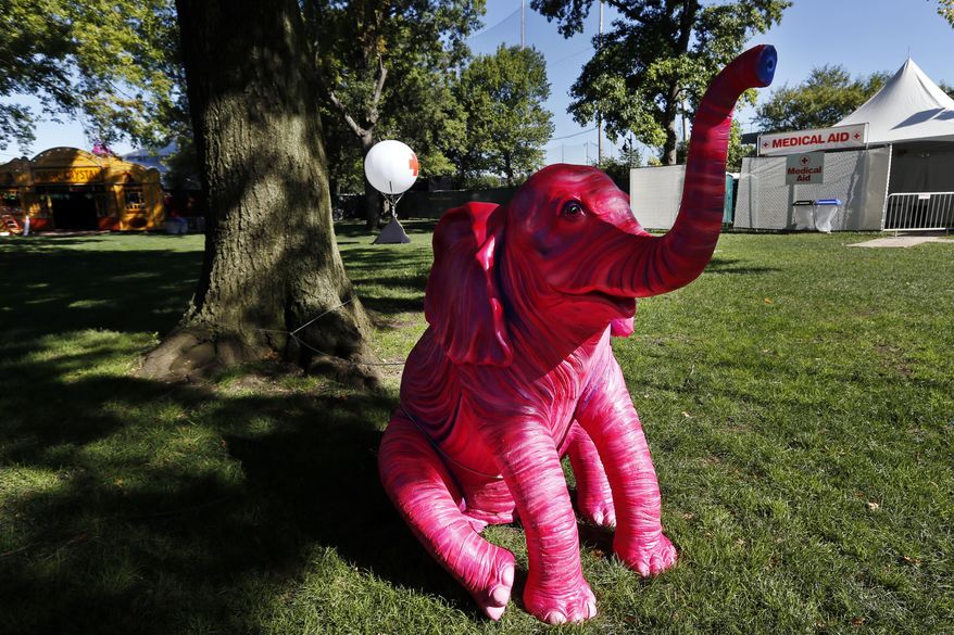 A pink elephant sculpture sits adjacent to a medical tent at the Electric Zoo music festival venue on New York's Randall's Island, Friday, Aug. 29, 2014. The final day of last year's festival was called off after two people died from an overdose of MDMA combined with hyperthermia. (AP Photo/Jason DeCrow) ** FILE **