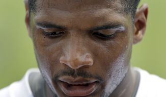 FILE - In this June 6, 2014, file photo, St. Louis Rams defensive end Michael Sam speaks to the media following an organized team activity at the NFL football team&#39;s practice facility in St. Louis. Sam, the first openly gay player drafted by an NFL team, was released by the Rams Saturday, Aug. 30, 2014. (AP Photo/Jeff Roberson, File)
