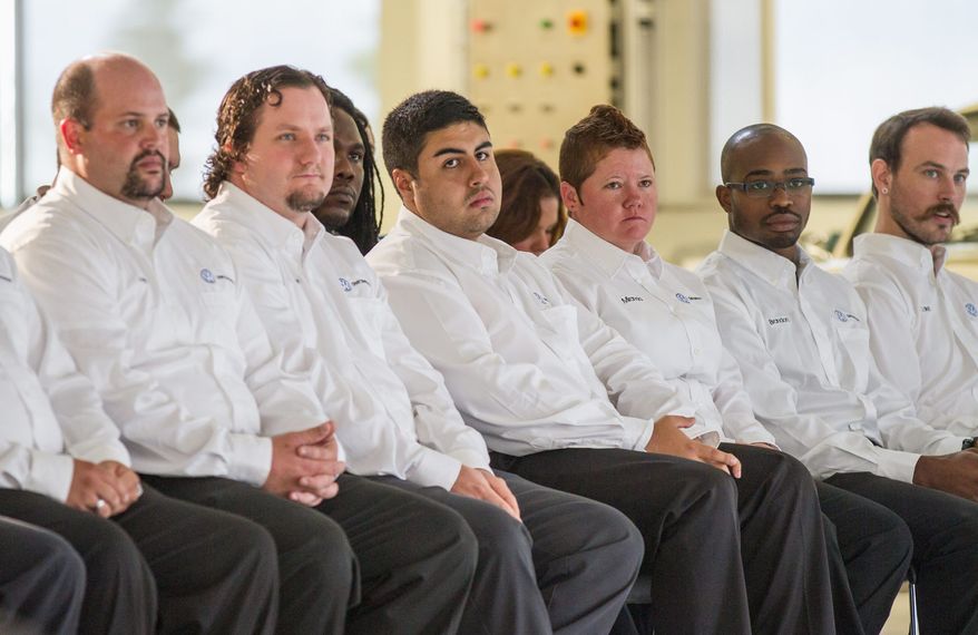 Participants in first apprenticeship class at Volkswagen's plant in Chattanooga, Tenn., listen to graduation speakers in August 2013.Tennessee's political leaders got involved helping VW connect with local community colleges that could help train young people to work in its highly automated factory. The payoff: VW is bringing its cutting-edge German manufacturing culture to Tennessee, including a devotion to protecting the environment as well as cultivating good worker relations. (Associated pRess)