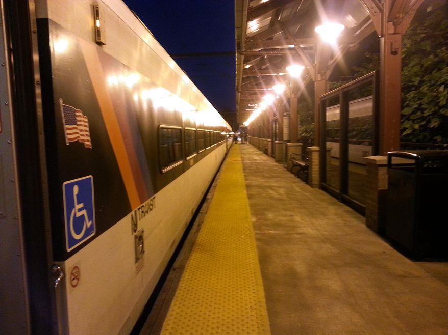 A New Jersey Transit train sits at the Middletown station after a a train ahead of it on New Jersey Transit's North Jersey Coast Line route struck and killed a person, Monday, Sept. 1, 2014. Service was been suspended in both directions between the Long Branch and Avenel stations. NJ Transit spokesman William Smith says a New York-bound train struck and killed a person who stepped in front if it at approximately 5:30 a.m. Monday, near the Aberdeen Matawan station. (AP Photo/Caleb Jones)