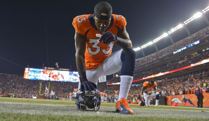 Denver Broncos strong safety Duke Ihenacho (33) kneels in the end zone before playing against the San Diego Chargers in an NFL football game, Thursday, Dec. 12, 2013, in Denver. (AP Photo/Jack Dempsey)