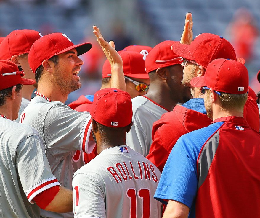 Philadelphia Phillies Cole Hamels,left, and teammates celebrate a 7-0 no hitter against the Atlanta Braves in a baseball game in Atlanta on Monday, Sept. 1, 2014. Hamels went six innings and relievers Jake Diekman, Ken Giles and closer Jonathan Papelbon combined to no-hit the Braves. i (AP Photo/Atlanta Journal-Constitution, Curtis Compton) MARIETTA DAILY OUT; GWINNETT DAILY POST OUT; LOCAL TELEVISION OUT; WXIA-TV OUT; WGCL-TV OUT