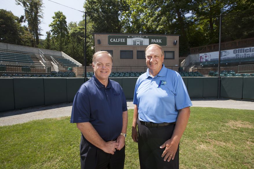 Incoming owner David Hagan, left, stands with outgoing owner, Wayne Carpenter, on the field of Calfee Park. Hagan and a business partner, Larry Shelor, purchased the park from Carpenter and his business partners, Tom Compton and Rick Mansell, who had operated the park for 25 years.
