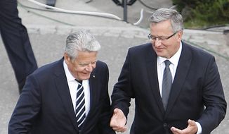 Poland&#x27;s President Bronislaw Komorowski, right, and his German counterpart Joachim Gauck take part in a ceremony marking 75 years since World War II started, at Westerplatte in Gdansk, Poland, Monday Sept. 1, 2014. Some of the first shots of World War II were fired on Sept. 1, 1939 by an attacking Nazi German warship on Westerplatte, a Polish munitions depot that held off for many days. More than five years of brutal, global war followed, taking the lives of tens of millions of people. (AP Photo/Czarek Sokolowski)