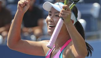 Peng Shuai, of China, reacts after defeating Belinda Bencic, of Switzerland, during the quarterfinals of the 2014 U.S. Open tennis tournament, Tuesday, Sept. 2, 2014, in New York. (AP Photo/Mike Groll)