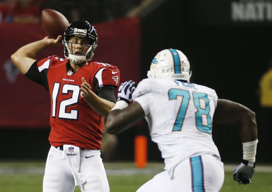 FILE - In this Aug. 8, 2014, file photo, Miami Dolphins defensive end Terrence Fede (78) pursues Atlanta Falcons quarterback Sean Renfree (12) during the second half of an NFL preseason football game in Atlanta. A year ago, Fede was playing for Marist College. Today, he's with the Dolphins. Small-school guys are getting big-time chances with the Dolphins this season, and Fede might have been the longest of long shots to make this team. (AP Photo/John Bazemore, File)