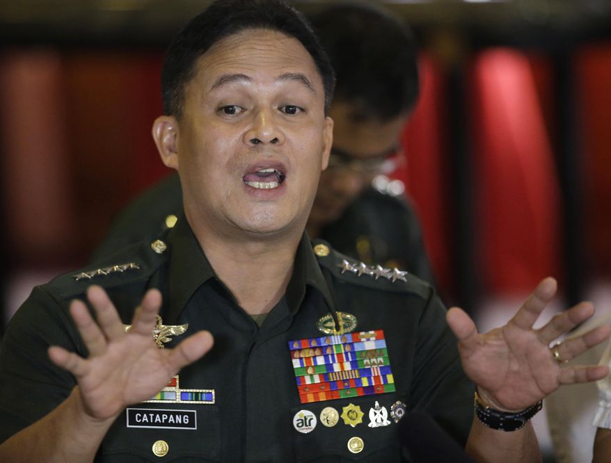 Philippine Armed Forces Chief Gen. Gregorio Pio Catapang gestures as he talks about "the greatest escape" of Philippine troops deployed as UN Peacekeepers in the Golan Heights while being besieged by a rebel faction in Syria, during a forum with foreign correspondents Tuesday, Sept. 2, 2014 at suburban Mandaluyong city, east of Manila, Philippines. Catapang said that a U.N. peacekeeping commander in the Golan Heights should be investigated for allegedly asking Filipino troops to surrender to Syrian rebels who had attacked and surrounded their camp. Catapang further said he advised the 40 Filipino peacekeepers not to lay down their arms, and they defied the U.N. peacekeeping commander's order. Instead, they staged a daring escape from the Golan camp over the weekend, ending a tense, dayslong standoff.(AP Photo/Bullit Marquez)