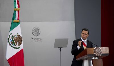 Mexico&#39;s President Enrique Pena Nieto gives his second state-of-the-nation address inside the National Palace in Mexico City, Tuesday, Sept. 2, 2014.  (AP Photo/Eduardo Verdugo)