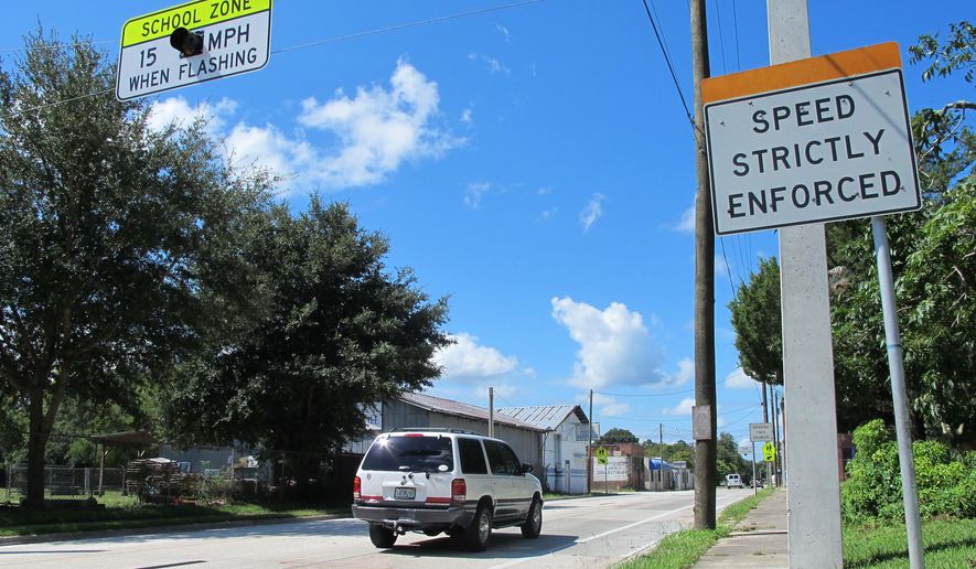 In this Aug. 29, 2014 photo, drivers enter the town of Waldo, Fla., where motorists can encounter many different speed limits in a roughly two-mile drive. The AAA auto club named the tiny town between Jacksonville and Gainesville one of only two “traffic traps” nationwide. The other town is nearby Lawtey. Now Waldo is facing a scandal over its traffic tickets. (AP Photo/Jason Dearen)