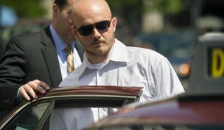 FILE - In this June 11, 2014, file photo, former Blackwater Worldwide guard Nicholas Slatten enters a taxi cab as he leaves federal court in Washington, after the start of his trial. After 10 weeks of argument and testimony, the case goes to the jury on Tuesday, Sept. 2, 2014. (AP Photo/Cliff Owen, File)