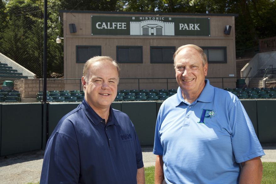 Incoming owner David Hagan, left, stands with outgoing owner, Wayne Carpenter, on the field of Calfee Park. Hagan and a business partner, Larry Shelor, purchased the park from Carpenter and his business partners, Tom Compton and Rick Mansell, who had operated the park for 25 years. Amanda Loman/Special to The Washington Times.