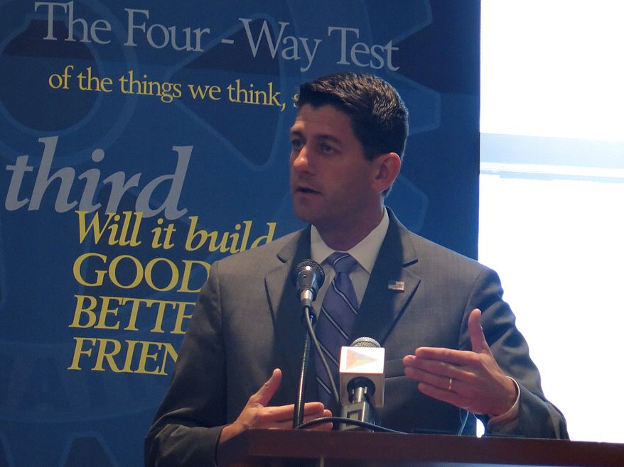 U.S. Rep. Paul Ryan takes questions from a panel of reporters, Tuesday, Sept. 2, 2014, at the Rotary Club of Milwaukee. Ryan blamed the Obama administration for contributing to the circumstances that led to the swift ascent of the Islamic State, a militant group that purportedly beheaded a second American journalist in two weeks. (AP Photo/Dinesh Ramde)