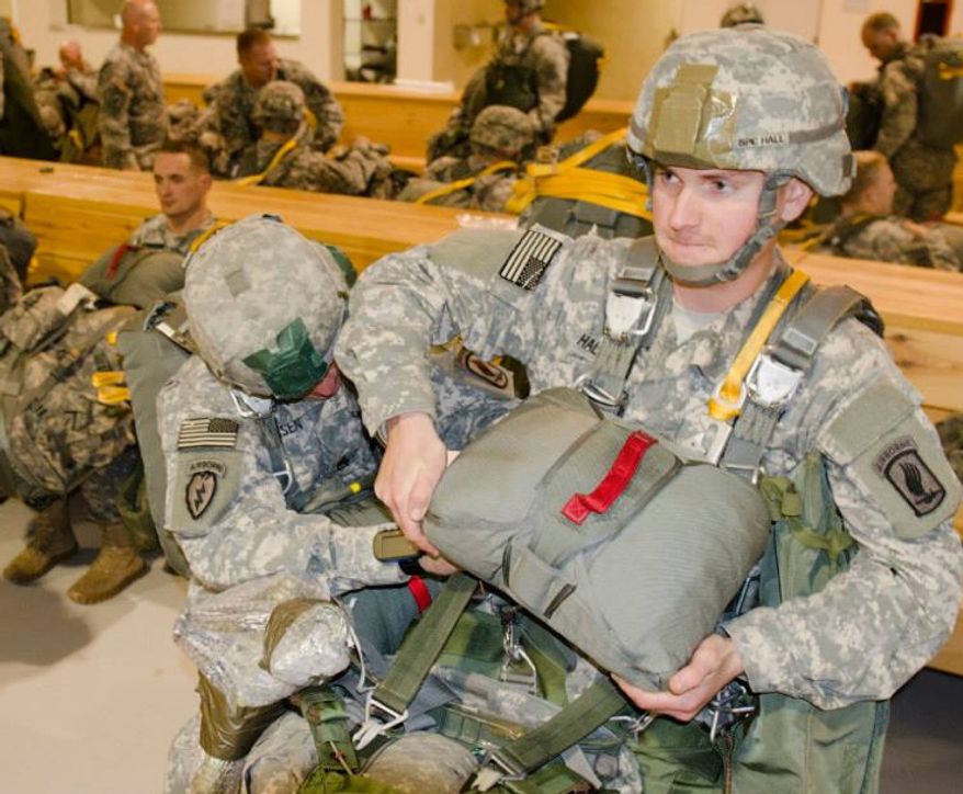** FILE ** Paratroopers from The 173rd Airborne Brigade Combat Team prepared for and executed a test of its contingency response abilities here Nov. 21, 2013 at Aviano Air Base, Italy. (U.S. Army)