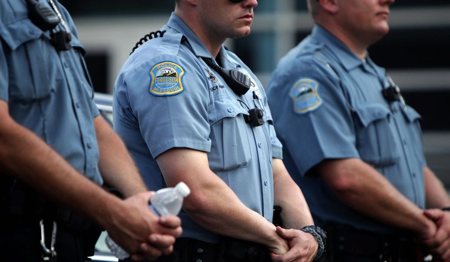 SMILE: Body-mounted cameras, like ones used by other U.S. police forces, are coming to District. (Associated Press)
