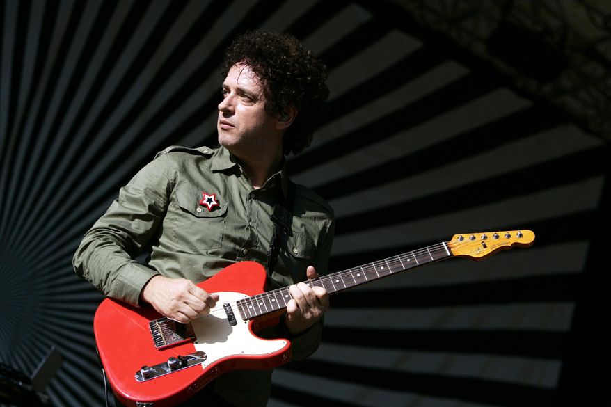 FILE - In this Aug. 5, 2006 file photo, Soda Stereo front man Gustavo Cerati, of Argentina, performs with his band in New York's Central Park on the SummerStage. Cerati died at the age of 55 on Thursday, Sept. 4, 2014, according to the singer's family. Cerati had been in a coma since May 15, 2010 when he suffered a stroke following a performance in Caracas, Venezuela. (AP Photo/Jeff Christensen, File)