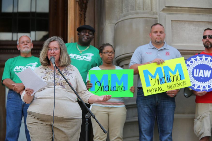 ADVANCE FOR SUNDAY, SEPT. 7 AND THEREAFTER - In a Thursday, Aug. 21, 2014 photo, Nancy Holle leads a rally at the Statehouse, to kick off Indiana Moral Mondays. Indiana Moral Mondays is one of a dozen groups cropping up nationwide with the goal of rolling back what they call “extremist” state laws. (AP Photo/The Indianapolis Star, Kelly Wilkinson) NO SALES