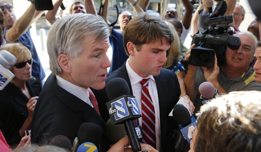 Former Virginia Gov. Bob McDonnell  arrives at Federal Court with his son, Bobby, right,  for the third day of jury deliberations in his corruption trial in Richmond, Va., Thursday, Sept. 4, 2014.    (AP Photo/Steve Helber)