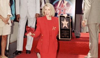 FILE - In this July 26, 1989 file photo, comedian Joan Rivers poses next to her star on the Hollywood Walk of Fame during her induction ceremony in Los Angeles. Rivers, the raucous, acid-tongued comedian who crashed the male-dominated realm of late-night talk shows and turned Hollywood red carpets into danger zones for badly dressed celebrities,  died Thursday, Sept. 4, 2014. She was 81. Rivers was hospitalized Aug. 28, after going into cardiac arrest at a doctor&#x27;s office.  (AP Photo/Doug Sheridan, File)