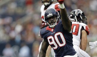 FILE - In this Aug. 16, 2014, file photo, Houston Texans&#39; Jadeveon Clowney (90) celebrates after he sacked Atlanta Falcons&#39; Matt Ryan (2) during the first quarter of an NFL preseason football game  in Houston.  (AP Photo/Patric Schneider, File)