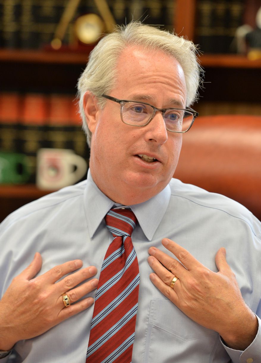 Attorney General Sam Olens speaks at his office, Thursday, Sept. 4, 2014 in Atlanta. State lawyers handling a lawsuit against the state ethics commission were dealing with a "difficult client" who acted inappropriately in withholding key documents, Attorney General Sam Olens said Thursday in response to his office being fined $10,000 by a judge in the case. (AP Photo/Atlanta Journal-Constitution, Hyosub Shin) MARIETTA DAILY OUT; GWINNETT DAILY POST OUT; LOCAL TELEVISION OUT; WXIA-TV OUT; WGCL-TV OUT