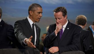 President Obama and British Prime Minister David Cameron at the start of a NATO-Afghanistan round table on Thursday in Newport, Wales. (AP Photo/Matt Dunham)