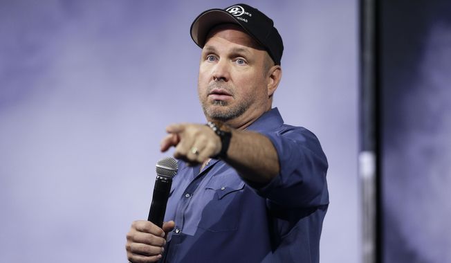 FILE - This July 10, 2014 file photo shows Country music star Garth Brooks speaking at a news conference in Nashville, Tenn. Brooks announced Thursday, Sept. 4 at a news conference that he’s partnered with the creators of digital pay site ghosttunes.com to release his back catalog and two new albums for about $30 and is encouraging other artists to join him in taking control of their music. (AP Photo/Mark Humphrey, File)