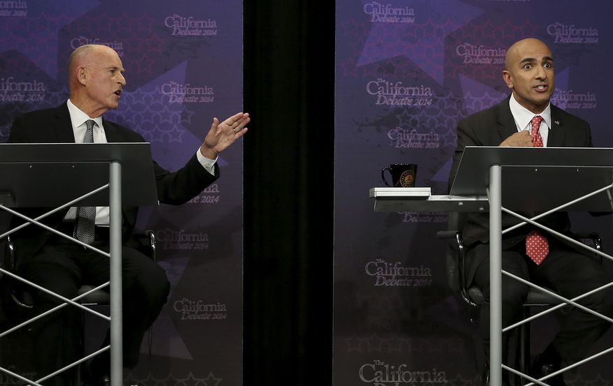 Gov. Jerry Brown, left, gestures as Republican challenger Neel Kashkari speaks during a gubernatorial debate in Sacramento, Calif., Thursday, Sept. 4, 2014. Thursday's debate is likely to be the only one of the general election. (AP Photo/Rich Pedroncelli, Pool)