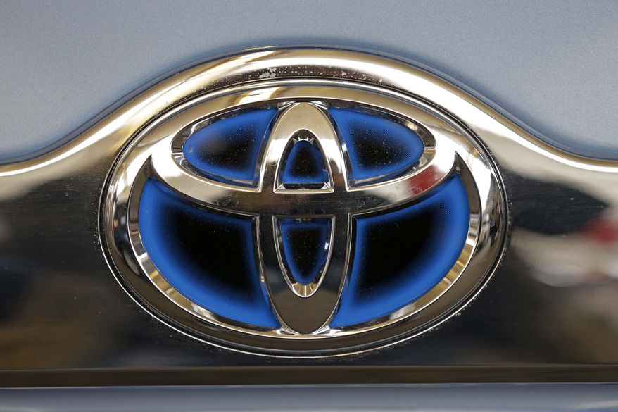 FILE - This Feb. 14, 2013 file photo shows the Toyota logo on the trunk of a Toyota automobile at the 2013 Pittsburgh Auto Show in Pittsburgh. Toyota executives on Thursday, Sept. 4, 2014 promised by 2017 to have collision-prevention technology installed across its U.S. line-up, in both mainstream and luxury vehicles. (AP Photo/Gene J. Puskar, File)