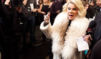 FILE - In this Feb. 14, 2012 file photo, Joan Rivers tours backstage with her camera crew for E!&#x27;s &quot;Fashion Police,&quot; before the Badgley Mischka show  during Fashion Week in New York. In the intense, high-stakes world of fashion, Joan Rivers helped change the game. Rivers, the raucous, acid-tongued comedian who crashed the male-dominated realm of late-night talk shows and turned Hollywood red carpets into danger zones for badly dressed celebrities,  died Thursday, Sept. 4, 2014. She was 81. Rivers was hospitalized Aug. 28, after going into cardiac arrest at a doctor&#x27;s office. (AP Photo/John Minchillo, File)