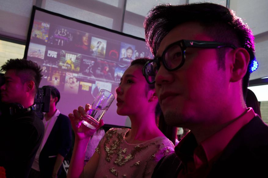 In this photo taken Tuesday, Aug. 26, 2014, Chinese celebrities attend the party for Sohu's online streaming website to share their passion for U.S. TV shows in Beijing, China. Every foreign TV show and movie shown on Chinese online streaming sites will have to be approved by authorities by April or else go offline, the country’s broadcast regulator said Friday, Sept. 5, 2014 in a tightening of control over the online industry. (AP Photo/Ng Han Guan)