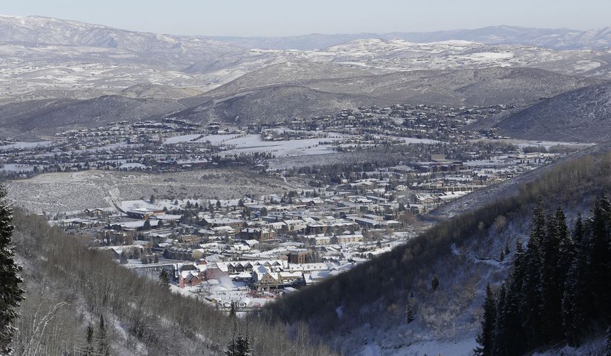 FILE - This Nov. 23, 2013, file photo, shows Park City from a trail at the Park City Mountain Resort, in Park City, Utah. A long-running court battle between two ski industry titans is putting the upcoming season in jeopardy at one of Utah's largest resorts. A Utah judge is expected to decide Friday how much Park City Mountain Resort must pay to cover back rent and court costs so it can stay open through April 2015. If the price tag is too high, the lifts could stand idle when the season opens in less than three months. (AP Photo/Rick Bowmer, File)