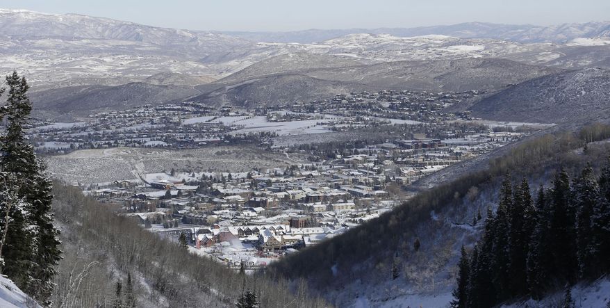 FILE - This Nov. 23, 2013, file photo, shows Park City from a trail at the Park City Mountain Resort, in Park City, Utah. A long-running court battle between two ski industry titans is putting the upcoming season in jeopardy at one of Utah's largest resorts. A Utah judge is expected to decide Friday how much Park City Mountain Resort must pay to cover back rent and court costs so it can stay open through April 2015. If the price tag is too high, the lifts could stand idle when the season opens in less than three months. (AP Photo/Rick Bowmer, File)