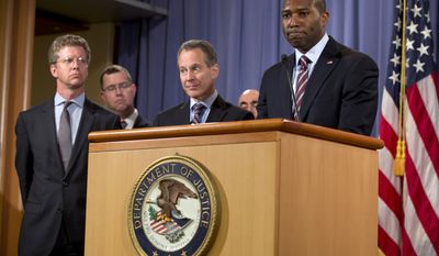 **FILE** Acting Associate Attorney General Tony West (right) speaks as New York Attorney General Eric Schneiderman (second from right), Stuart F. Delery (second from left), Acting Assistant Attorney General for the Civil Division, and Housing and Urban Development Secretary Shaun Donovan stand by during a news conference at the Department of Justice in Washington on Oct. 2, 2012, about the first legal action of the Residential Mortgage-Backed Securities (RMBS) Working Group. (Associated Press)