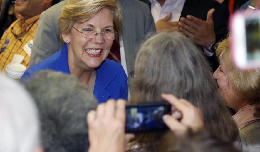 U.S. Sen. Elizabeth Warren, D-Mass., greets supporters during appearance at a campaign headquarters for U.S. Sen. Mark Udall, D-Colo., in northwest Denver suburb of Wheat Ridge, Colo., on Friday, Sept. 5, 2014. (AP Photo/David Zalubowski) ** FILE ** 