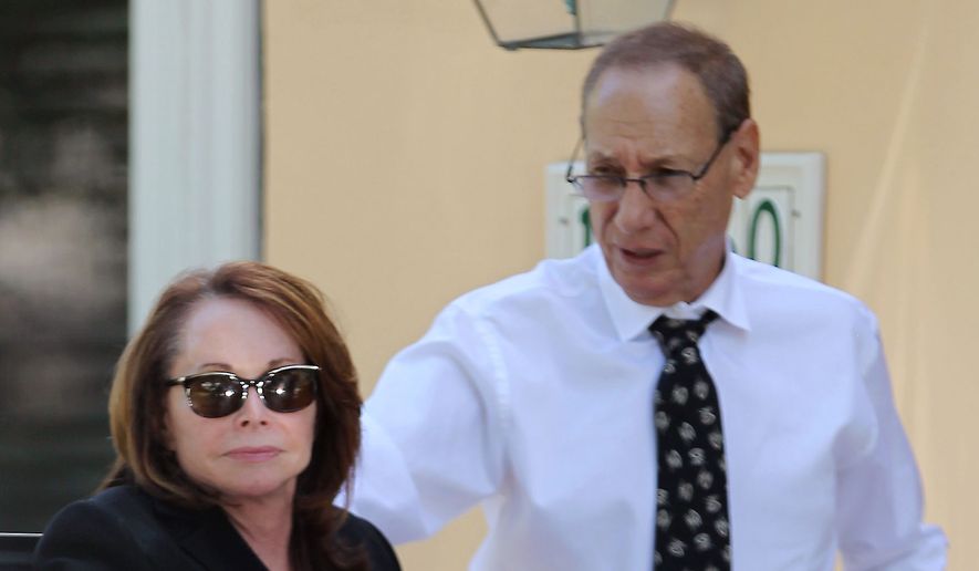 Shirley Sotloff and her husband Arthur B. Sotloff exit a car as they return home after the memorial service for their son, slain journalist Steven Sotloff, at Temple Beth Ann, Friday, Sept. 5, 2014, in Pinecrest, Fla. The Islamic State has beheaded two American journalists it held captive for what the militants called payback for more than 120 U.S. airstrikes on its assets in northern Iraq since Aug. 8. Journalists James Foley and Sotloff were two of what the State Department has described as &quot;a few&quot; Americans still being held hostage by the group. (AP Photo/The Miami Herald, Carl Juste)  