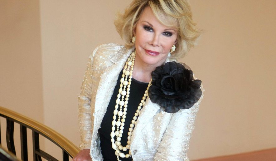 FILE - This Oct. 5, 2009 file photo shows Joan Rivers posing as she presents &amp;quot;Comedy Roast with Joan Rivers &amp;quot; during the 25th MIPCOM (International Film and Programme Market for TV, Video, Cable and Satellite) in Cannes, southeastern France. In October 1986, Rivers made TV history as the first woman hosting a late-night broadcast talk show. She was the first face of the Fox network, headlining its first program, &amp;quot;The Late Show Starring Joan Rivers.&amp;quot;  (AP Photo/Lionel Cironneau, File)