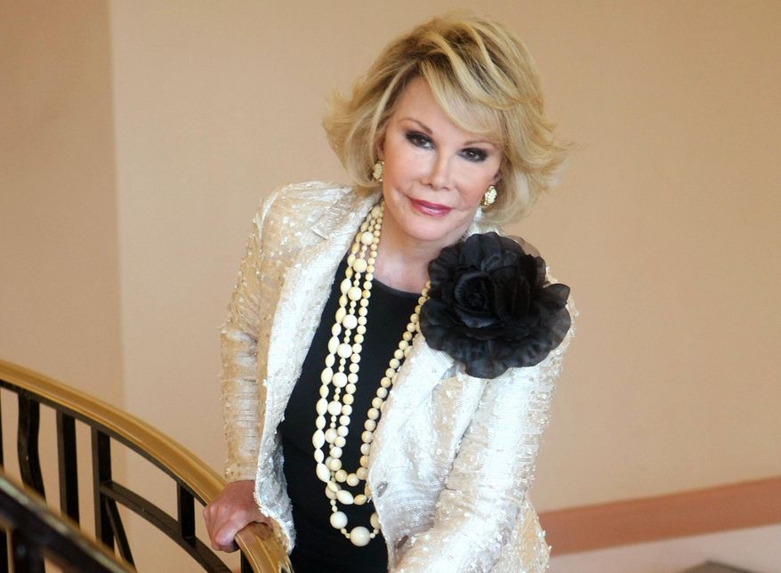FILE - This Oct. 5, 2009 file photo shows Joan Rivers posing as she presents "Comedy Roast with Joan Rivers " during the 25th MIPCOM (International Film and Programme Market for TV, Video, Cable and Satellite) in Cannes, southeastern France. In October 1986, Rivers made TV history as the first woman hosting a late-night broadcast talk show. She was the first face of the Fox network, headlining its first program, "The Late Show Starring Joan Rivers." (AP Photo/Lionel Cironneau, File)