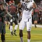 Nevada&#39;s Don Jackson (6) celebrates after scoring against Washington State during the first half of an NCAA college football game Friday, Sept. 5, 2014, in Reno, Nev. (AP Photo/Kevin Clifford)