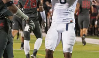 Nevada&#39;s Don Jackson (6) celebrates after scoring against Washington State during the first half of an NCAA college football game Friday, Sept. 5, 2014, in Reno, Nev. (AP Photo/Kevin Clifford)