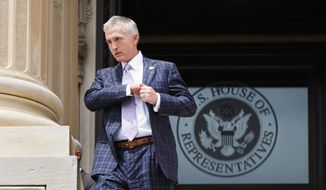 Rep. Trey Gowdy, R-S.C., chairman of the newly-formed Select Committee on Benghazi, walks down the steps of the House of Representatives on Capitol Hill in Washington, Friday, May 30, 2014, after final votes. (AP Photo/J. Scott Applewhite)