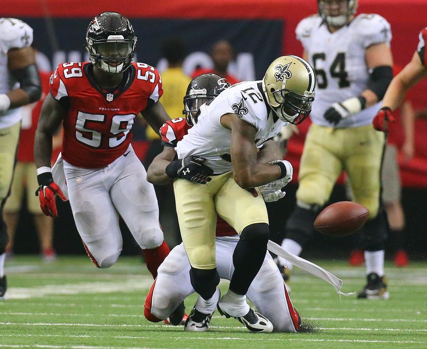 Falcons safety William Moore strips Saints wide receiver Marques Colston causing a fumble recovered by the Falcons in overtime in their NFL football game on Sunday, Sept. 7, 2014, in Atlanta. Falcons linebacker Joplo Bartu, left, recovered the fumble. The Falcons went on to kick a fieldgoal to win the game 37-34. (AP Photo/Atlanta Journal-Constitution, Curtis Compton) MARIETTA DAILY OUT; GWINNETT DAILY POST OUT; LOCAL TELEVISION OUT; WXIA-TV OUT; WGCL-TV OUT
