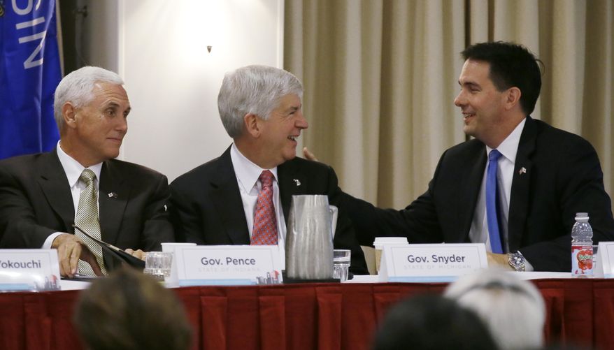 Wisconsin Gov. Scott Walker, right, talks with Indiana Gov. Mike Pence, left, and Michigan Gov. Rick Snyder, center, during the annual meeting of the Midwest U.S-Japan Association, Monday, Sept. 8, 2014, in Des Moines, Iowa. The group, founded in 1967, meets yearly to discuss the growth and progress of economic relations of the American Midwest and Japan. (AP Photo/Charlie Neibergall)