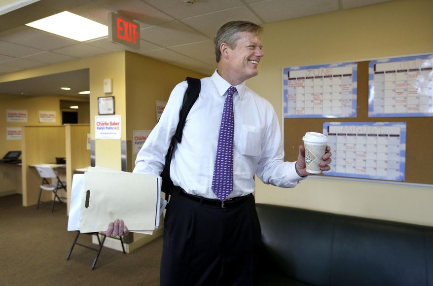 Massachusetts Republican gubernatorial hopeful Charlie Baker smiles as he greets members of the media at his campaign headquarters, Monday, Sept. 8, 2014, in Boston. Baker is seeking his party's nomination in the Sept. 9 primary. (AP Photo/Steven Senne)