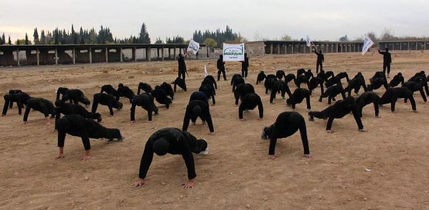 ** FILE ** Syria&#39;s Ahrar al-Sham members train at a camp in outside Damascus, December, 2013. (Associated Press)