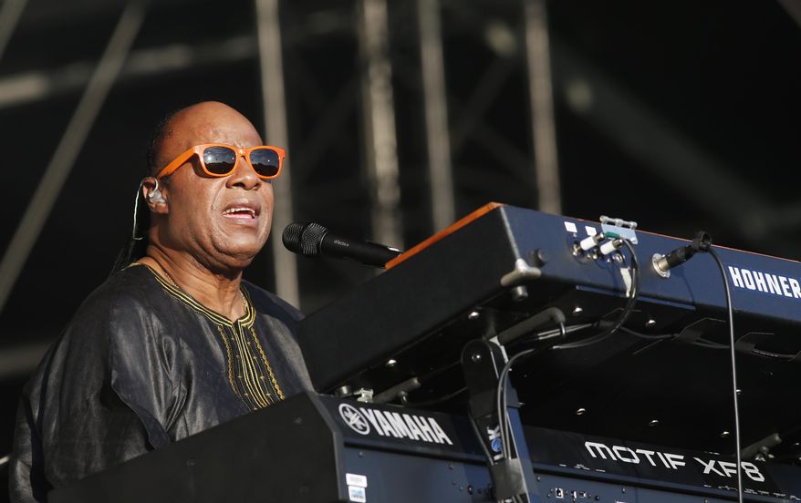 FILE - In this June 29, 2014 file photo, US singer Stevie Wonder performs at the Calling festival, in London. Wonder said the mayor of Ferguson, Mo., isn’t seeing the full picture a month after an unarmed black teenager was killed by a white police officer. “I don’t know if the mayor has blinders on,” Wonder said in an interview Wednesday, Sept. 10, 2014. “But to say that he didn’t know that there was a racial or cultural problem in the city is unfortunate.” (Photo by Jim Ross/Invision/AP)
