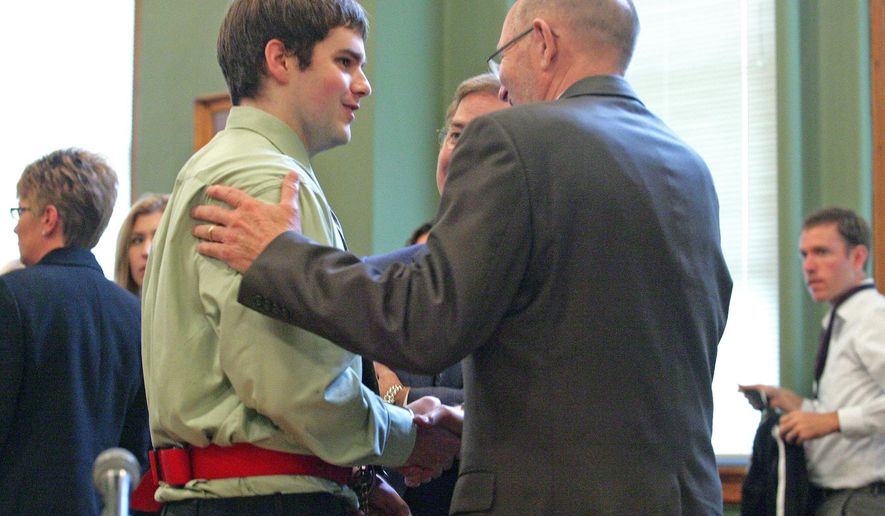 Seth Techel, left, confers with his attorney Wednesday, Sept. 10, 2014, at the Monroe County Courthouse in Albia, Iowa, after he was sentenced to life in prison for first-degree murder in the killing of his pregnant wife. A jury found Techel guilty in July of shooting his wife of seven months to death while she slept in the trailer they shared in Agency, a rural town in southeastern Iowa. She was four months pregnant with their first child, a girl they had agreed to name Zoey. (AP Photo/Ottumwa Courier, Patrick Shelby)